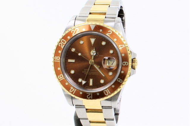 SÅLD - Rolex GMT Master II Guld/Stål 16713,